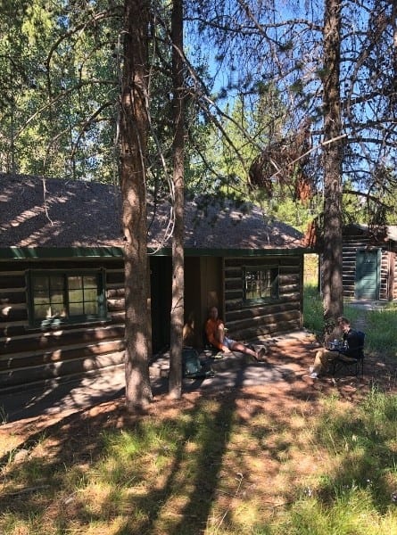 Relaxing outside at a two-bedroom cabin at Colter Bay Village