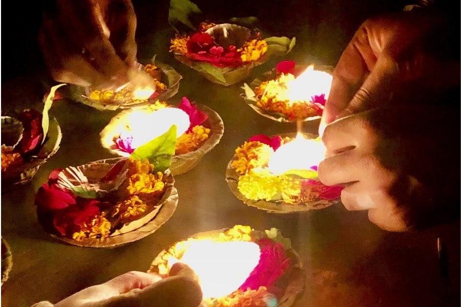 lighting the aarti on the ganges in varanasi