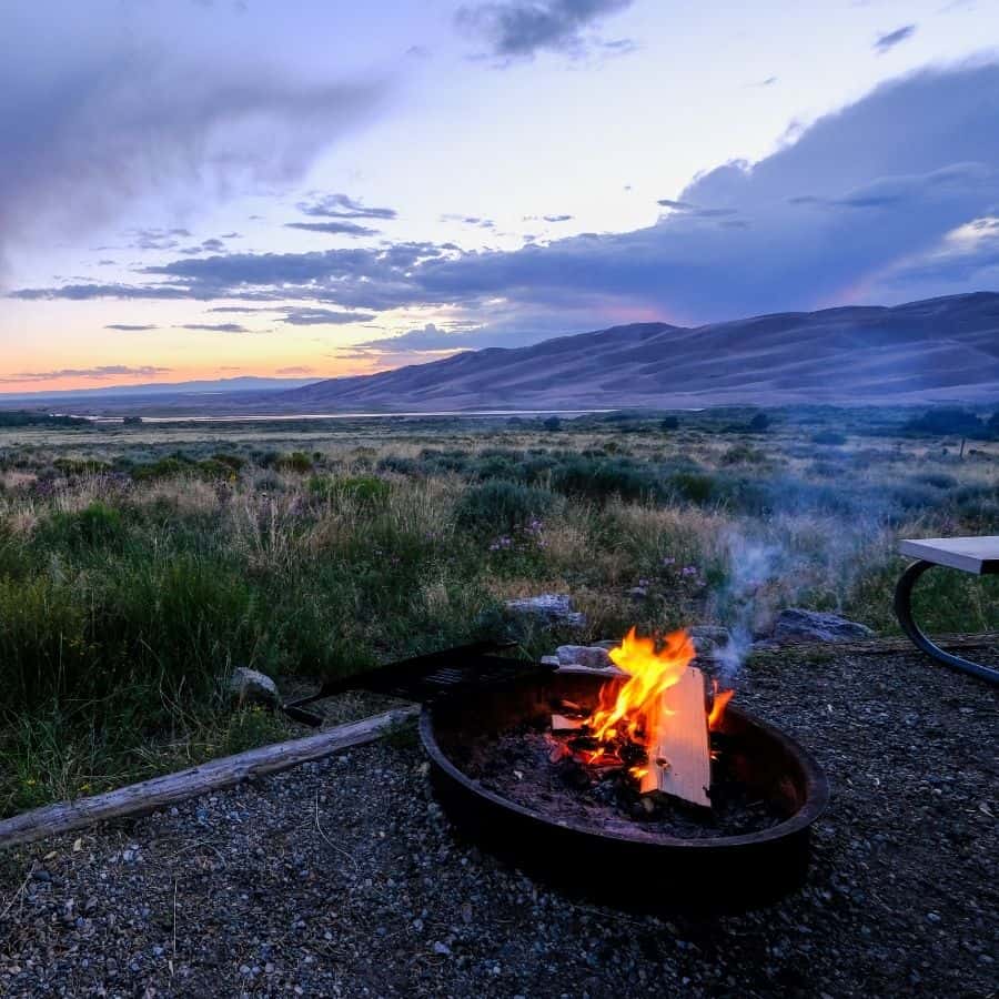 A campfire with view of the Great Sand Dunes National Park
