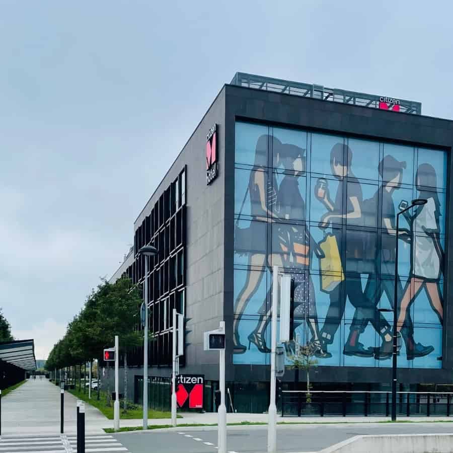 CitizenM Paris Charles de Gaulle airport hotel exterior with the walkway to the airport pictured on the left