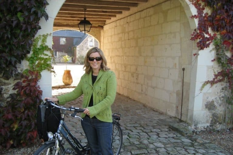Susan Heinrich pictured with a bicycle in the town of Linieres Bouton, in Loire Valley, France.