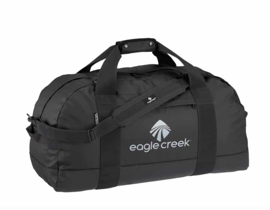 A black soft-sided duffle bag with the words Eagle Creek printed on the side.