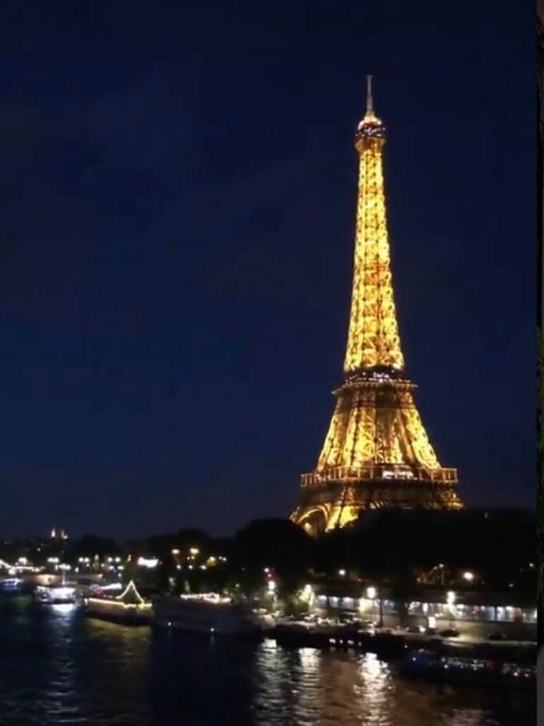 see the eiffel tower at night from the metro