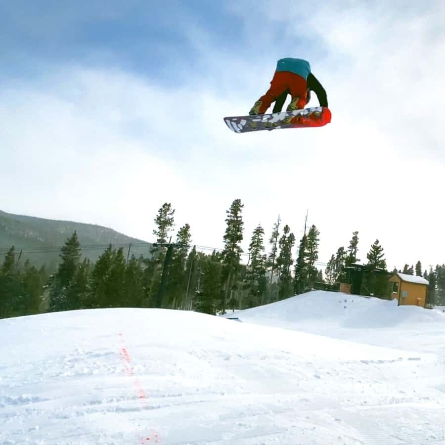 A snowboarder in the air at Eldora Ski Resort