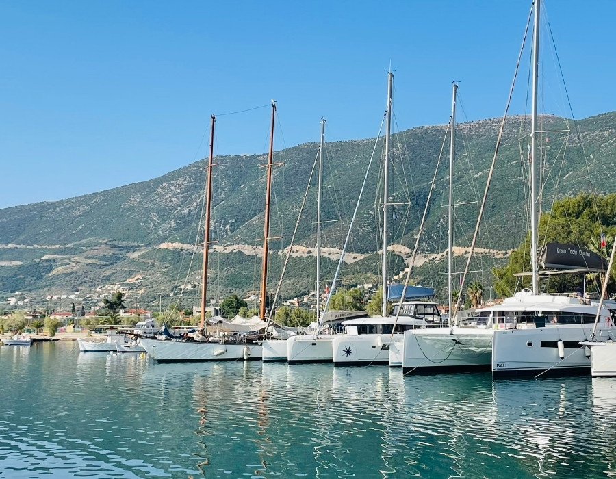 Sailboats are lined up in the port in Epidaurus Greece