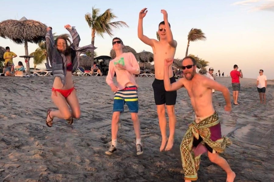 Jumping with my family on the beach, feeling healthy after hip replacement