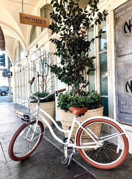 A bike is parked in front of Rotisseria in Venice California