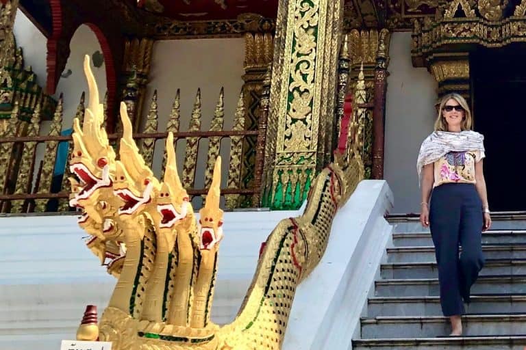 Susan Heinrich in Laos with a scarf - scarves are an important part of the travel packing guide