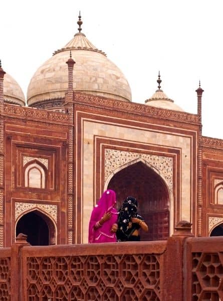 Ladies in saris outside of the Red Fort, a heritage site in Delhi