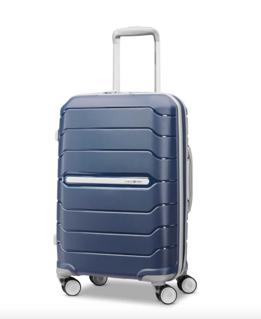 The Samsonite Freeform Carry-On Spinner in Navy against a white background. The handle is partially extended.