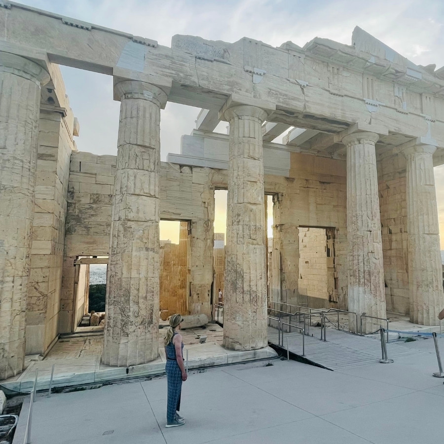 Susan Heinrich looks up at the Porch of the Caryatids at the Acropolis Greece on a solo trip to Athens