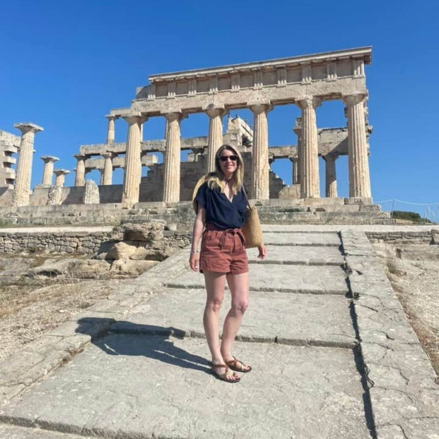 Susan Heinrich in front of the Temple of Aphaia in Aegina Greece