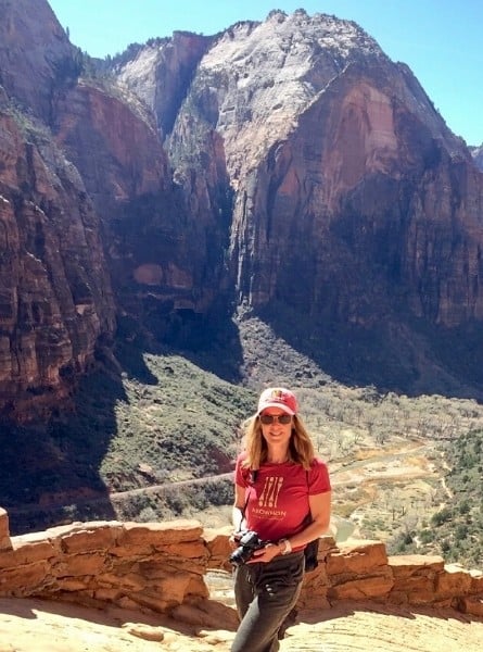 Susan Heinrich hiking in Zion National Parkon a road trip from Denver