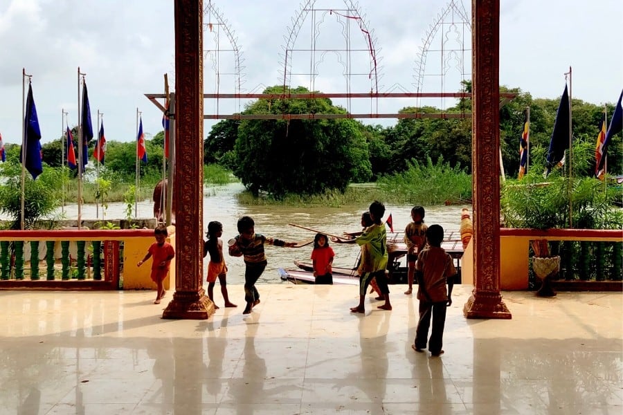 children play at village temple kampong phluk