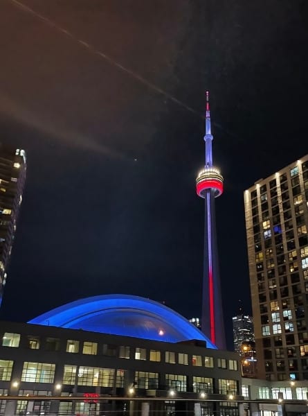 The Toronto skyline at night with the CN Tower and Rogers Centre lit up