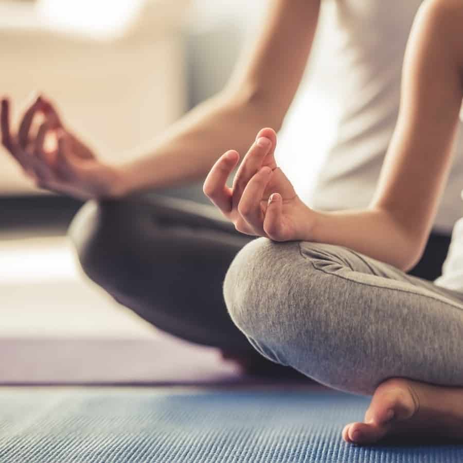 Two woman practice yoga