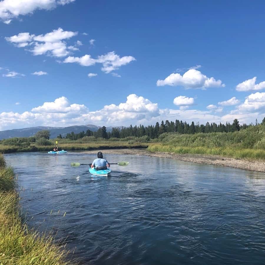 Kayaking on a river at Under Canva Yellowstone