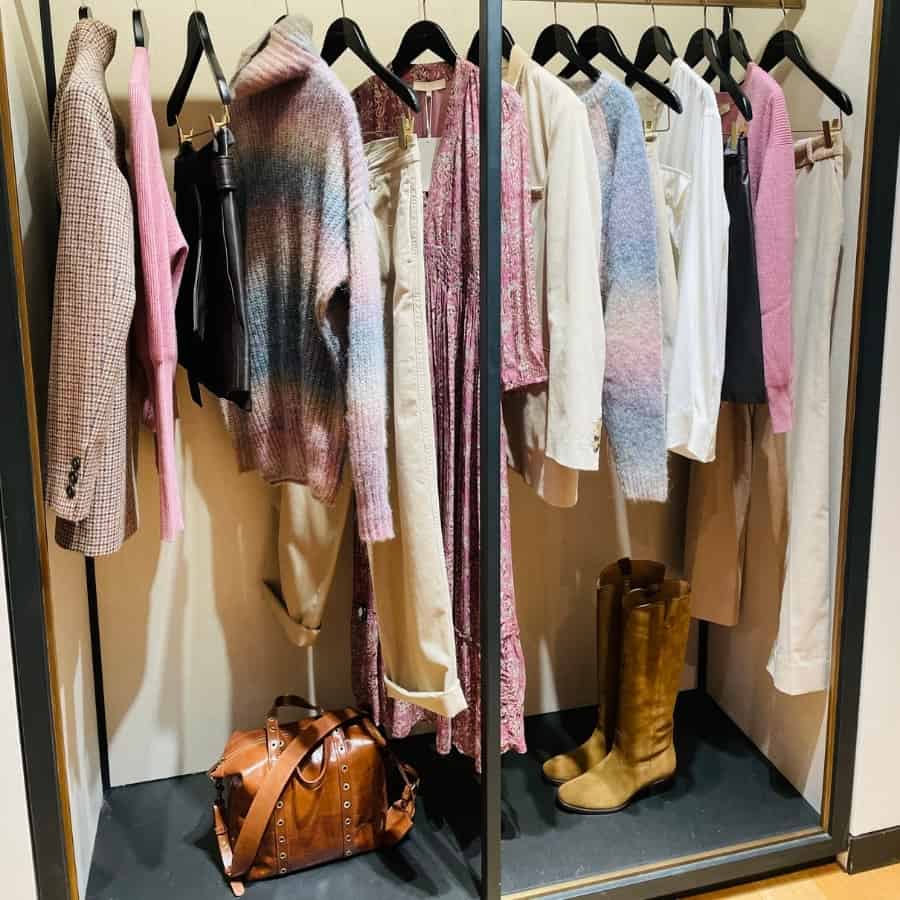 A rack of fall clothes in cream and mauve by Vanessa Bruno, a Paris clothing brand