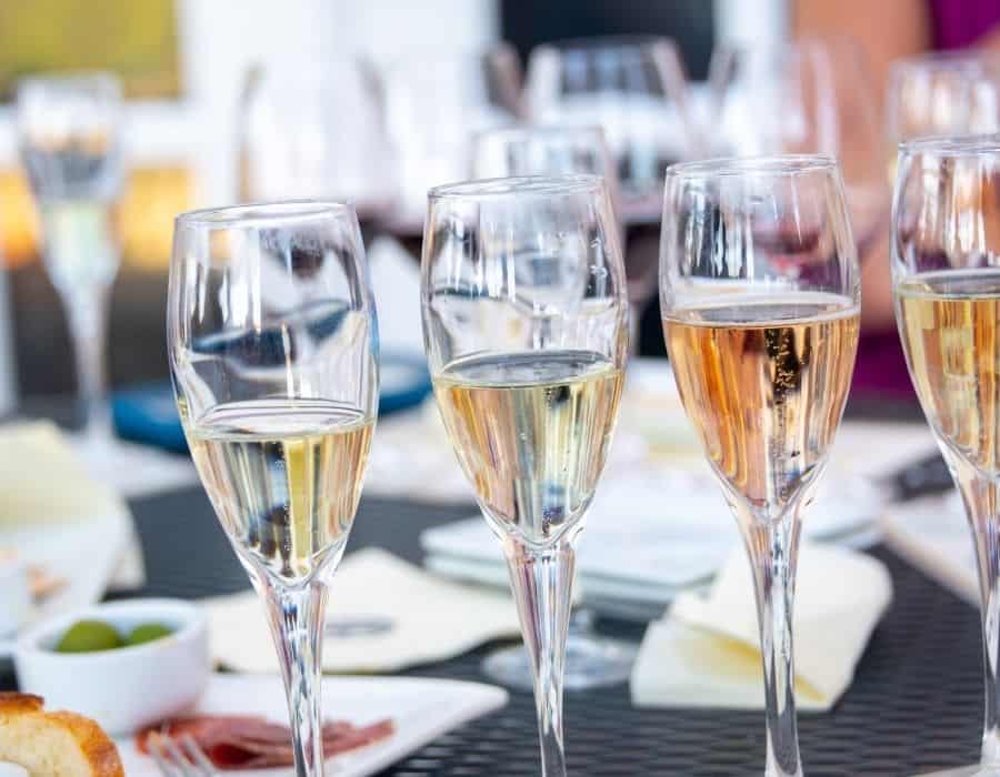 Wine glasses and a charcuterie plate are set out for wine tasting in Carmel California